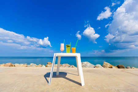 colorful cocktails on sea backgroundの写真素材