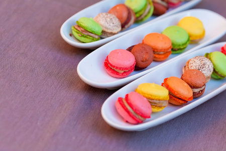 Colorful macaron isolated on a purple backgroundの写真素材