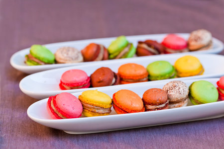 Colorful macaron isolated on a purple backgroundの写真素材