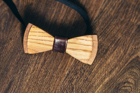 grooms wooden bow-tie on wooden backgroundの写真素材
