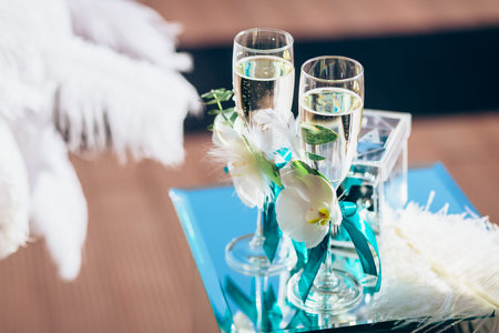 Luxury wine glasses with champagne, wedding decorationの写真素材