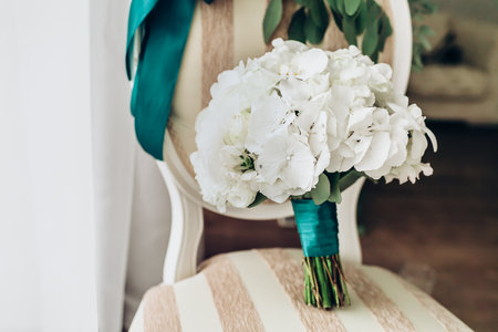 wedding bouquet of white roses on the chair, close-upの写真素材