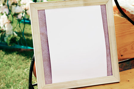 White photo frame on the table for wedding decoration