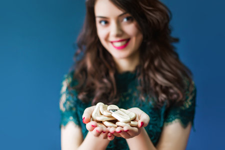 Young woman holding a lot of usb sticksの写真素材