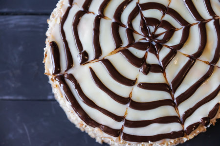 Delicious cake with nut chip and dark chocolate decorationの写真素材