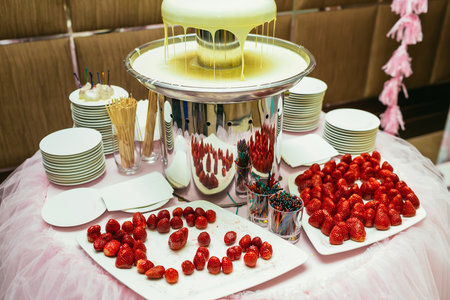 White chocolate fondue with strawberries on a classic wedding. Indoorsの写真素材