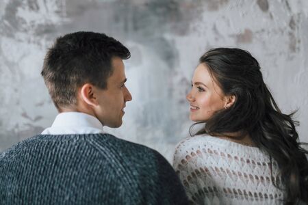 Young and happy newlyweds look at each other with love. Close-up portrait. Copy spaceの写真素材