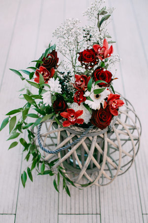 Wedding floristic decoration on a wooden stand outdoors on open countrysideの写真素材