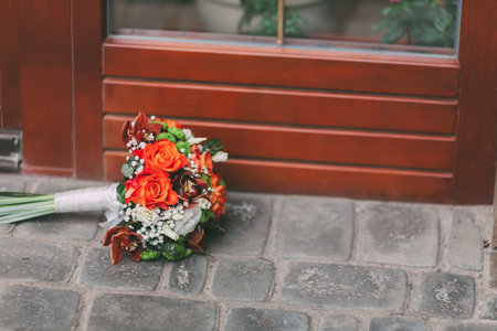Wedding bouquet of roses lying on the street. Artwork. Soft focus .Copy spaceの写真素材