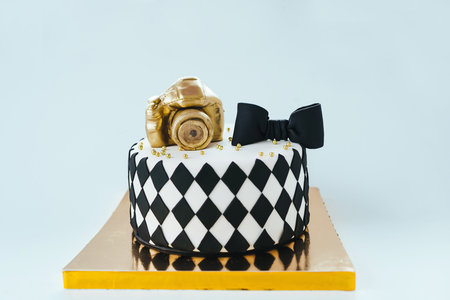 Black and White Birthday Cake For Photographer On Bright Background.の写真素材