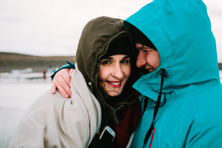 Traveling Man And Woman Exploring The Iceland Together. Ice Lagoon. Iceland traveling.の写真素材