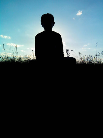 little boy on a background of the sunの写真素材
