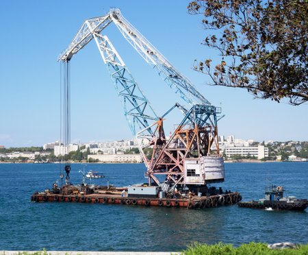 Shunting water works barge with craneの写真素材