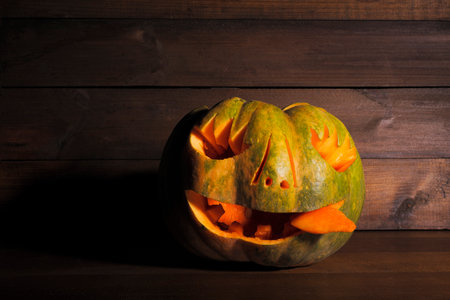 halloween concept. halloween pumpkin on wooden background. pumpkin carvingの写真素材