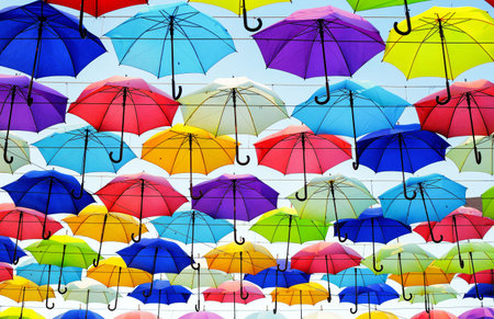 Colorful umbrellas background. Colorful umbrellas in the sky. Street decoration.の写真素材