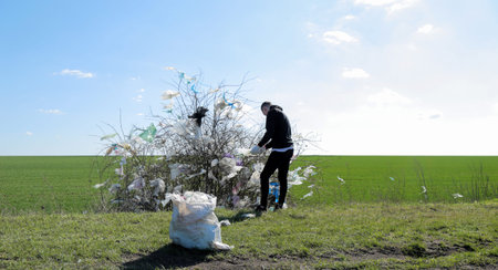 environmental pollution. trash in the trees. bad attitude to nature. garbage. ecology concept. paern...