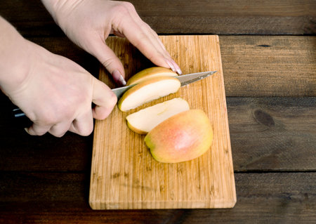 apple cutting on the board kitchen cooking chefの写真素材