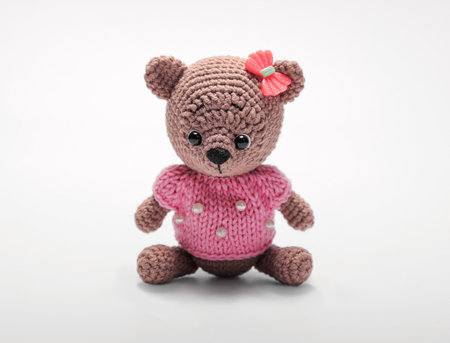 Cute handmade toy. knitted animal. the mouse. on a gray background. Crochet stuffed animals.の写真素材