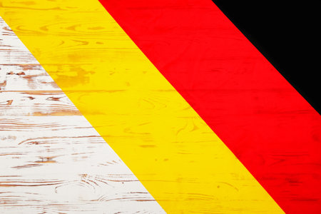 national flag of Germany. close-up. german symbol. on a white wooden backgroundの写真素材