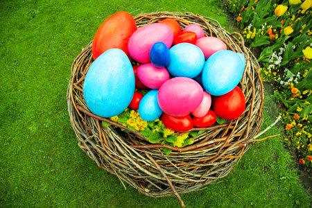 easter concept. basket with Easter eggs on the grass. against the backdrop of beautiful nature....