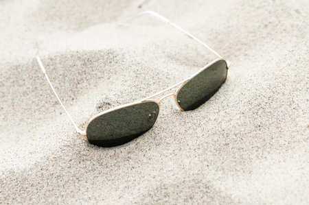 Sunglasses on the sandの写真素材