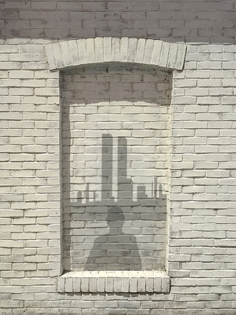 Shadow image of man overlooking NYC skylineの写真素材