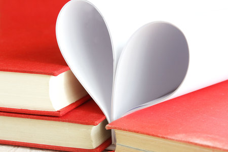 Pages of a book curved into a heart shape