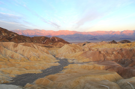 Sunrise in Zabriskie Point  East of Death Valley in Death Valley National Park in the US   This erosional landscape is composed of sediments from Furnace Creek Lake, which dried up 5 million years ago の写真素材