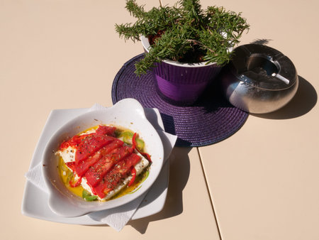 Baked feta cheese salad with vegetables and olive oilの写真素材