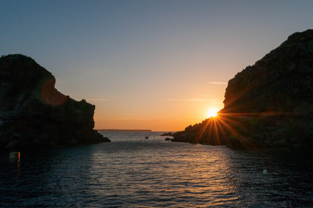 Sunset view from the boat,  Santorini island, Greeceの写真素材