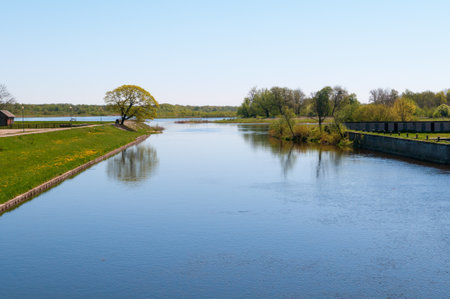 Small river Pakalne reflects blue sky, rusne island, lithuaniaの写真素材