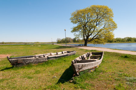 Two old boats at the Nemunas river, Rusne island, Lithuaniaの写真素材
