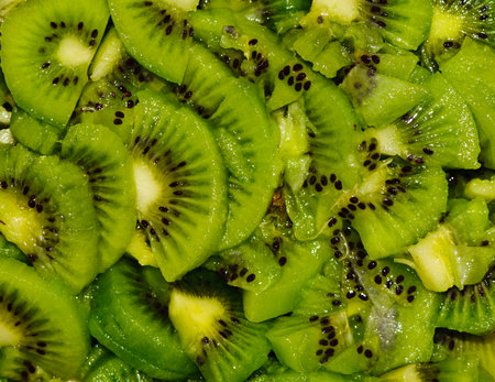 Healthy food background with green kiwi fruits slicesの写真素材