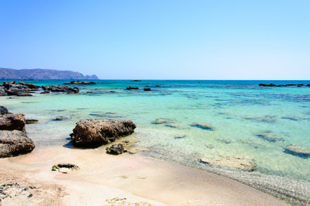 Elafonisi or Elafonissi, "deer island" in Greek, is an island located close to the southwestern corner of the Mediterranean island of Crete, Greece. Elafonisi is an oblong, which often "breaks" in two parts by water giving the impression of being a separaの写真素材