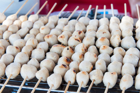 Traditional Thai meatballs on bamboo sticks, a very popular street food in Thailandの写真素材