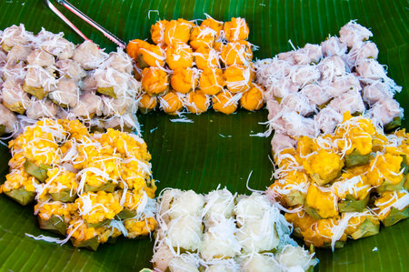 Sweet traditional Thai dessert, wrapping and serving on banana leavesの写真素材