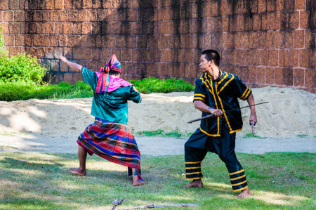 Nakhon Pathom, Thailand - May 24, 2014: Fighters exercise for Thai traditional martial demonstration at Samphran Elephant Ground & Zoo on May 24, 2014 in Nakhon Pathom,Thailand. Visitors can watch an elephant show complete with dramatic sounds and narratiのeditorial素材
