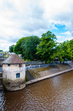 York, United Kingdom - August 9, 2014: View over River Ouse and bridge in the city of York, UK.York is a historic walled city at the confluence of the Rivers Ouse and Foss in North Yorkshire, England and is the traditional county town of Yorkshire to whicの写真素材