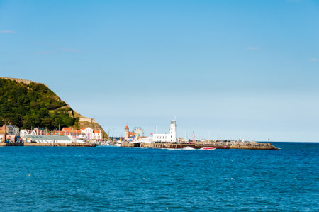 Scarborough, North Yorkshire, England - August 24, 2014: View over Scarborough South Bay harbor.The town has fishing and service industries and is the largest holiday resort on the Yorkshire coast, one of the famous tourist destinations in England.のeditorial素材