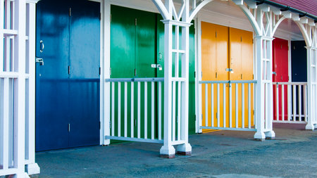 View of Bright colored beach huts on summer dayの写真素材