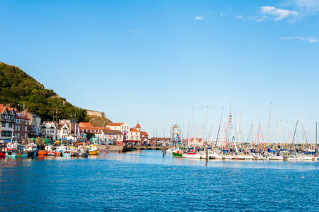 Scarborough, North Yorkshire, England - August 24, 2014: View over Scarborough South Bay harbor.The town has fishing and service industries and is the largest holiday resort on the Yorkshire coast, one of the famous tourist destinations in England.のeditorial素材