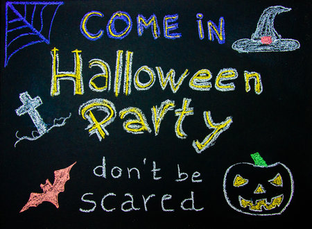 Halloween Party invitation sign on blackboardの写真素材