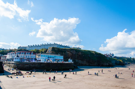 Whitby, North Yorkshire, UK - October 12, 2014: View of Whitby beach in a sunny autumn day.Whitby is a seaside town and port in North Yorkshire, UK. Its attraction as a tourist destination is enhanced by its association with the world famous horror novel のeditorial素材