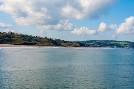 View of Whitby beach in a sunny autumn day.Whitby is a seaside town and port in North Yorkshire, UK. の写真素材