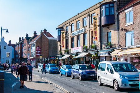 Whitby, North Yorkshire, UK - October 12, 2014: Scenic view of Whitby city in sunny autumn day.Whitby is a seaside town and port in North Yorkshire, UK. Its attraction as a tourist destination is enhanced by its association with the world famous horror noのeditorial素材