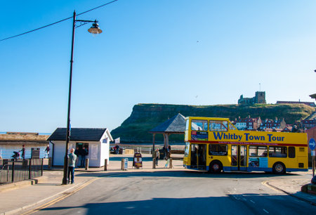Whitby, North Yorkshire, UK - October 12, 2014: Scenic view of Whitby city and abbey in sunny autumn day.Whitby is a seaside town and port in North Yorkshire, UK. Its attraction as a tourist destination is enhanced by its association with the world famousのeditorial素材