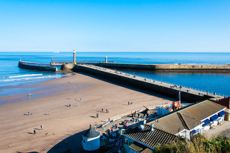 Whitby, North Yorkshire, UK - October 12, 2014: View of Whitby beach in a sunny autumn day.Whitby is...