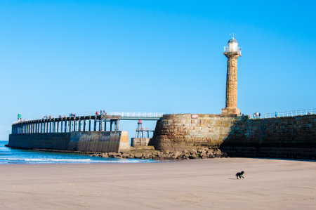 View of Whitby beach in a sunny autumn day.Whitby is a seaside town and port in North Yorkshire, UK.の写真素材