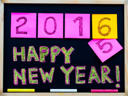 Happy New Year 2016 message hand written on blackboard,celebration concept