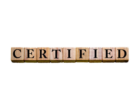 Word CERTIFIED. Wooden small cubes with letters isolated on white background with copy space available. Concept image.の写真素材